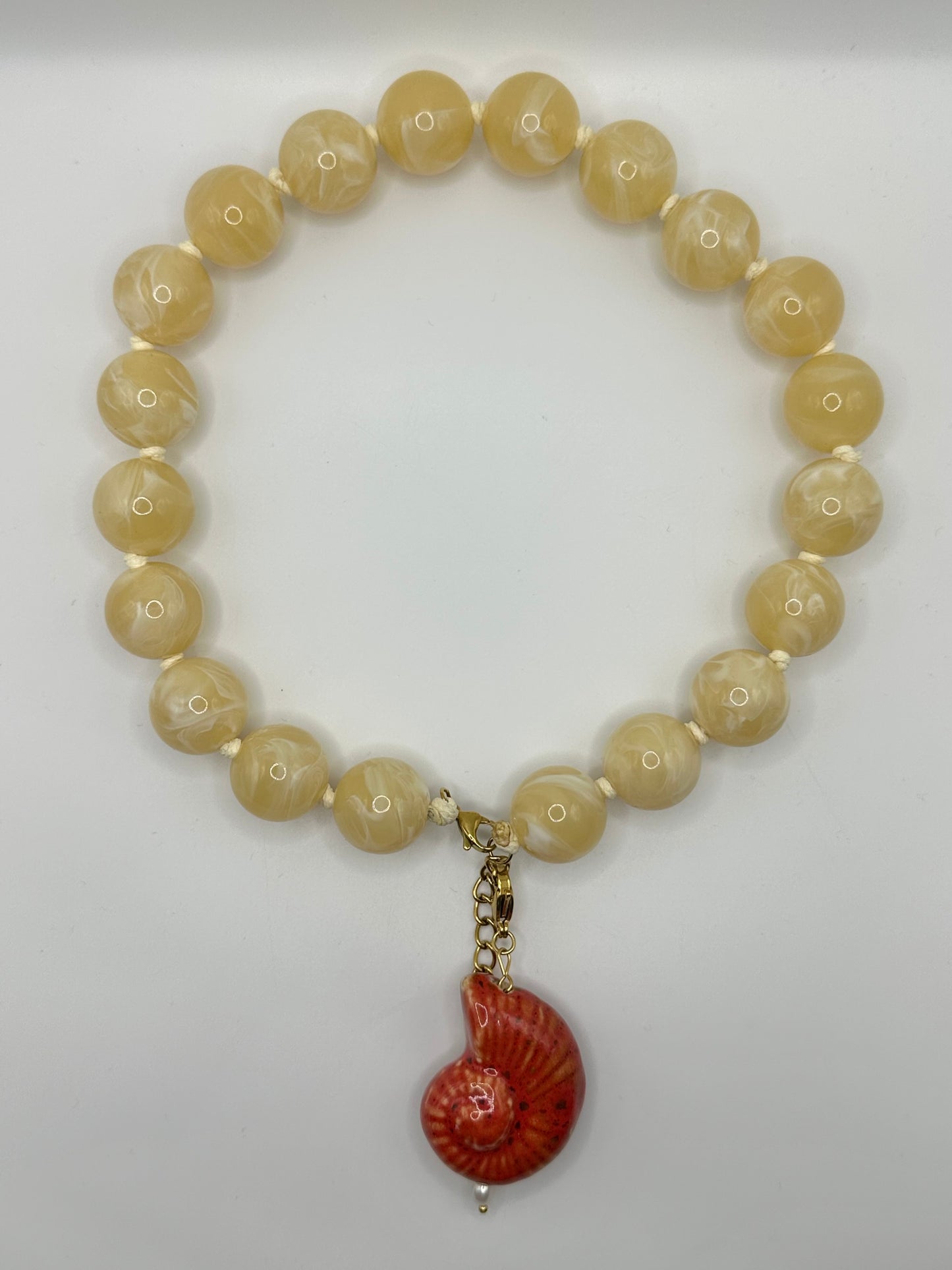 CHARM CARACOLA ROJA